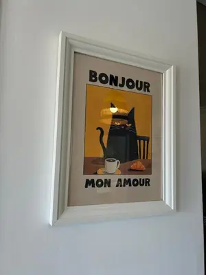 a framed picture of a cat with a cup of coffee at Cozy Beachside Apartment in Cros de Cagnes - Luna in Cagnes-sur-Mer