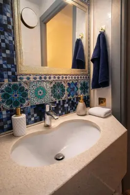 a bathroom with blue and white tiles and a shower at Magnifique studio centre-ville in Nice