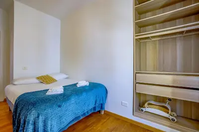 a small bedroom with a bed and a closet at Maison Bianchi - Chauvain Place Massena in Nice