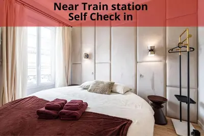 a bedroom with a bed with two pillows on it at Coeur de La Libé - Ideal couple & FRIENDS - CENTRAL & COSY - TRAM & Supermarkets -AC -Bed XXL in Nice