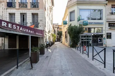 an empty street in a city with buildings at Coeur de La Libé - Ideal couple & FRIENDS - CENTRAL & COSY - TRAM & Supermarkets -AC -Bed XXL in Nice