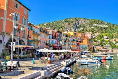 a group of buildings and boats in a harbor at Le BASHKIR - SPACIEUX AVEC TERRASSE - WIFI - prés mer et aéroport - Tram et supermarchés in Nice