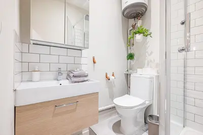 a small bathroom with a toilet and a sink at Le PETIT JEAN- CENTRAL PRES GARE ET TRAM - supermarchés - WIFI - in Nice