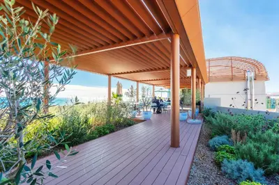 a wooden deck with awning on the side of a building at PLAZA TERRACE AP4065 by RIVIERA HOLIDAY HOMES in Nice