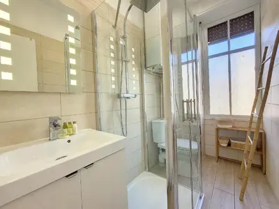 a bathroom with a sink and a shower and a toilet at Nestor&Jeeves - BLEU BUFFA - Central location in Nice