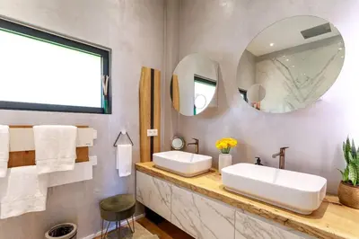 a bathroom with two sinks and two mirrors at Luxury Villa Nice in Nice