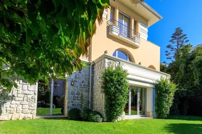 a large building with a balcony on the side of it at Luxury Villa Nice in Nice