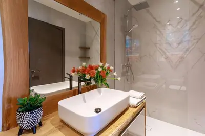 a white bathroom with a sink and a shower at Luxury Villa Nice in Nice