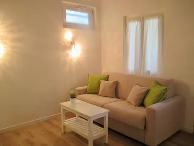 a living room with a couch and a table at Villa Bellabé in Nice