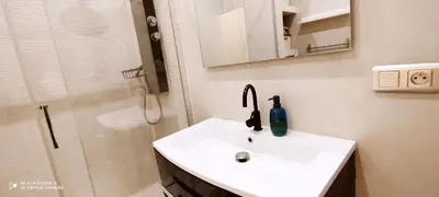 a bathroom with a sink and a shower at Downtown in Nice