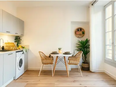 a kitchen with a table and chairs in a room at Modern apartment with AC near Old Nice & Beach in Nice