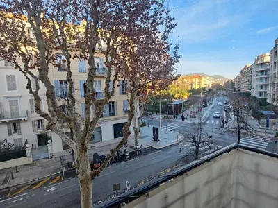 a view of a city street with a tree at Studio meublé in Nice