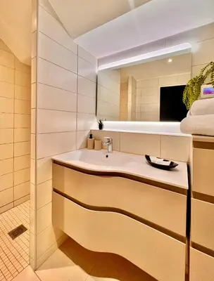 a bathroom with a sink and a mirror at Apartment Malaussena - Reception 24&7 - Center Libération in Nice