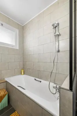 a bath tub in a bathroom with a shower at NICE RENTING - PHILIBERT - Elegant Spacious Quiet Near the Port Free Parking in Nice