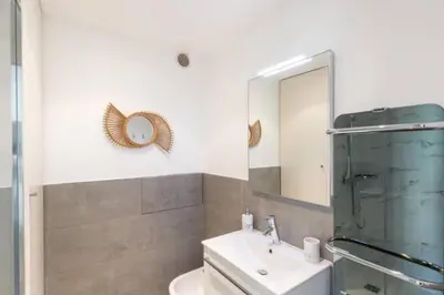 a bathroom with a sink and a mirror at MY CASA - JOFFRE 2-4 - Bright Central 1 bedroom Near Massena in Nice