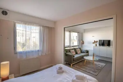 a bedroom with a bed and a living room at MY CASA - JOFFRE 2-4 - Bright Central 1 bedroom Near Massena in Nice