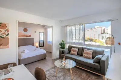 a living room with a couch and a bed at MY CASA - JOFFRE 2-4 - Bright Central 1 bedroom Near Massena in Nice