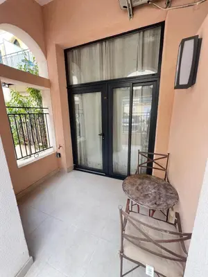 a balcony with a chair and a glass door at Magnifique Duplex Type Loft in Nice
