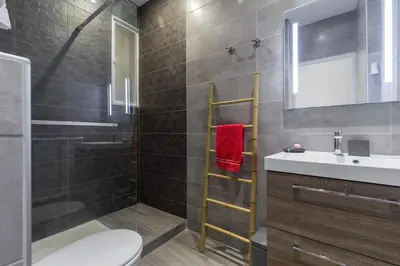 a bathroom with a shower toilet and a sink at Dolce vita in Nice