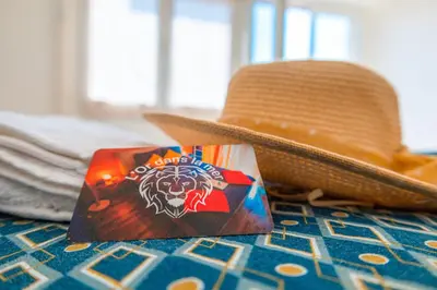 a cowboy hat and a bag of chips next to a hat at l'Or dans la Mer 3 in Nice