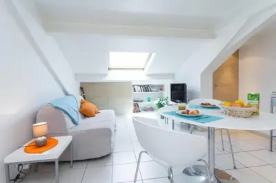 a living room with a couch and a table at MY CASA - PORT 1 - Spacious and central w AC on the Port in Nice