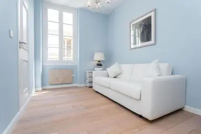 a living room with a white couch and blue walls at MY CASA - JEAN JAURES - 90m2 w AC 2min to Beach in Nice