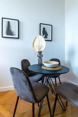 a dining room with a blue table and chairs at 301a Charming 2 rooms refurbished super center in Nice