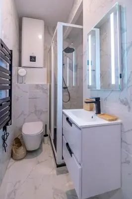 a white bathroom with a sink and a toilet at 301a Charming 2 rooms refurbished super center in Nice
