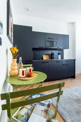 a kitchen with a table with a plate of food at 302b Beautiful studio refurbished Downtown / Ac in Nice
