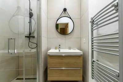 a bathroom with a sink and a mirror at Joli 2 pièces au port de Nice in Nice
