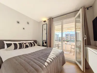 a bedroom with a bed and a balcony at Nestor&Jeeves -PERLE DOREE - Terrace - Design in Nice