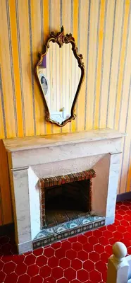 a mirror on a wall with a fireplace at Heart of Vieux Nice Beach & Saleya in Nice