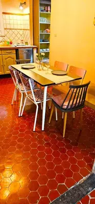 a kitchen with a table and chairs in a kitchen at Heart of Vieux Nice Beach & Saleya in Nice