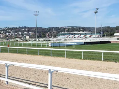 a race track with white rails and a race track at Apartment Villa Emeraude by Interhome in Cagnes-sur-Mer