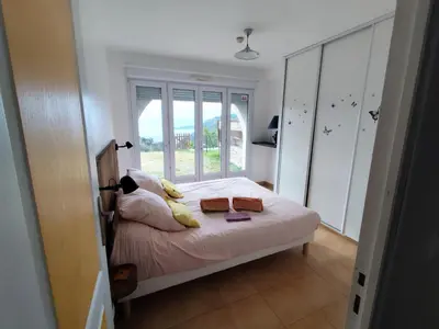 a bedroom with a bed with two towels on it at Location 2 pièces sur EZE à 3km de MONACO (2) in Èze