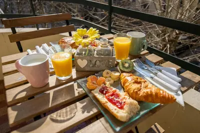 a table with a tray of breakfast foods and drinks at * Le Provençal * cosy flat 3 min walk from the sea in Nice