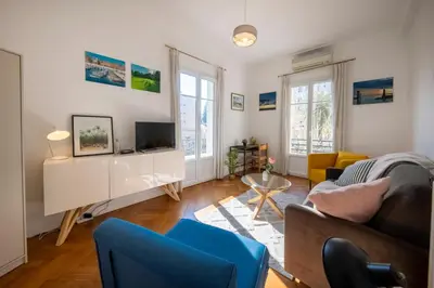 a living room with a couch and a tv at * Le Provençal * cosy flat 3 min walk from the sea in Nice