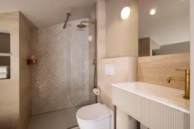 a bathroom with a shower and a sink at Crisol Mozart in Nice