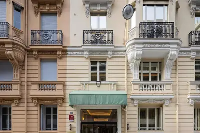 a advertisement for a continental breakfast with bread and orange juice at Crisol Mozart in Nice