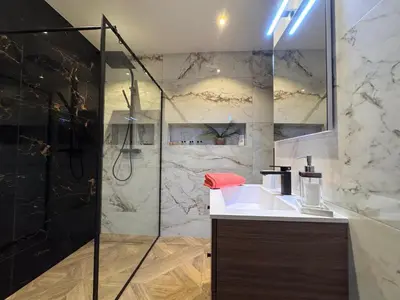 a bathroom with a sink and a shower at Oscar in Nice