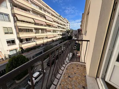 a balcony with a view of a street and buildings at Oscar in Nice