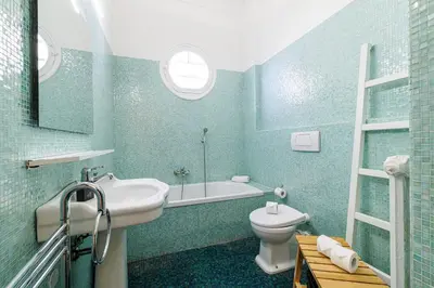 a bathroom with a sink and a toilet and a tub at Promenade des Anglais 2 Bdr Large Terrace in Nice