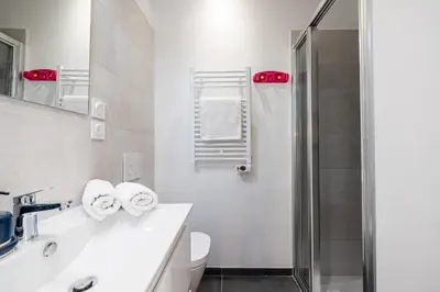 a bathroom with a sink and a shower at Charming City Center Studio 104 in Nice