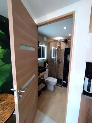 a bathroom with a toilet and a door at Riviera Cocoon - Nice Center in Nice