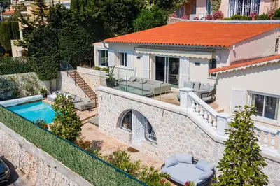 an aerial view of a house with a swimming pool at VILLA BELLE VUE VI4394 By Riviera Holiday Homes in Villefranche-sur-Mer