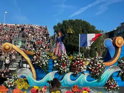 a woman standing on top of a float in a parade at Magenta MaMa - Comfort & Charm in Nice Carré d'Or - Near beach in Nice