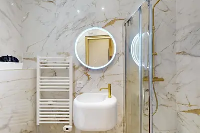 a bathroom with a sink and a shower at Suite Stars FSHH in Nice