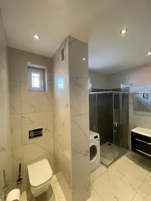 a bathroom with a toilet and a shower and a sink at Magnifique appartement avec vue sur mer in Nice