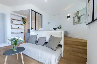 a living room with a white couch and a table at Franck Pilatte - Parking, Wifi, AC, 3pers in Nice