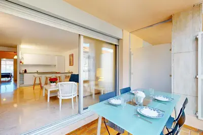 a dining room with a blue table and chairs at Suite Aquarius FSHH in Nice